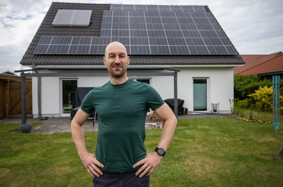 Arne in front of his house with solar system