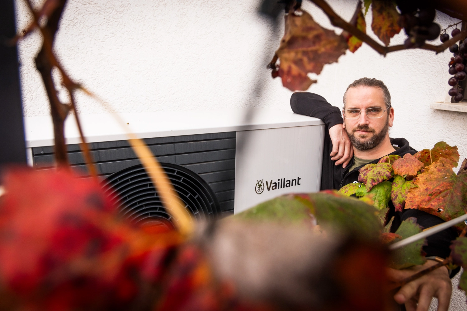 Tobias next to heat pump