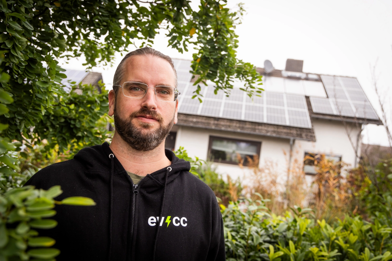 Tobias in front of house with solar panels
